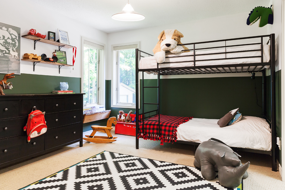 bunk beds and walls with lower half painted dark green