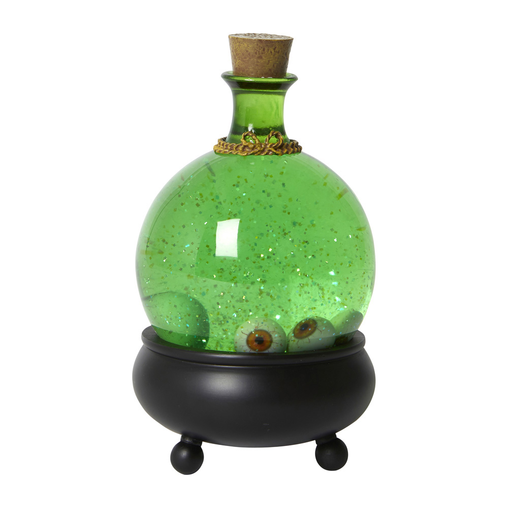 A clear bottle featuring green liquid a 