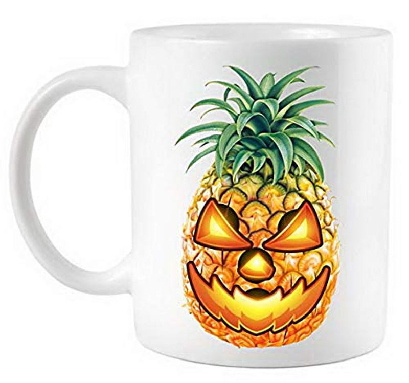 A mug with a pineapple jack o' lantern