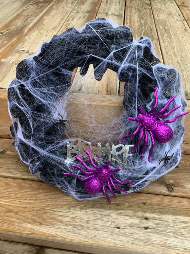 DIY Halloween wreath with big purple spiders