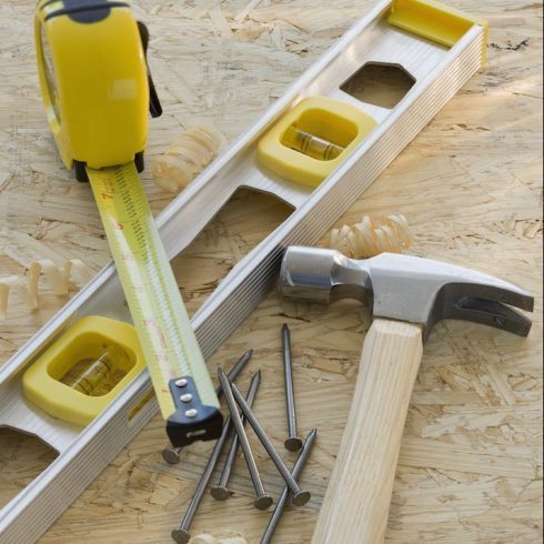hammer, level, measuring tape and nails
