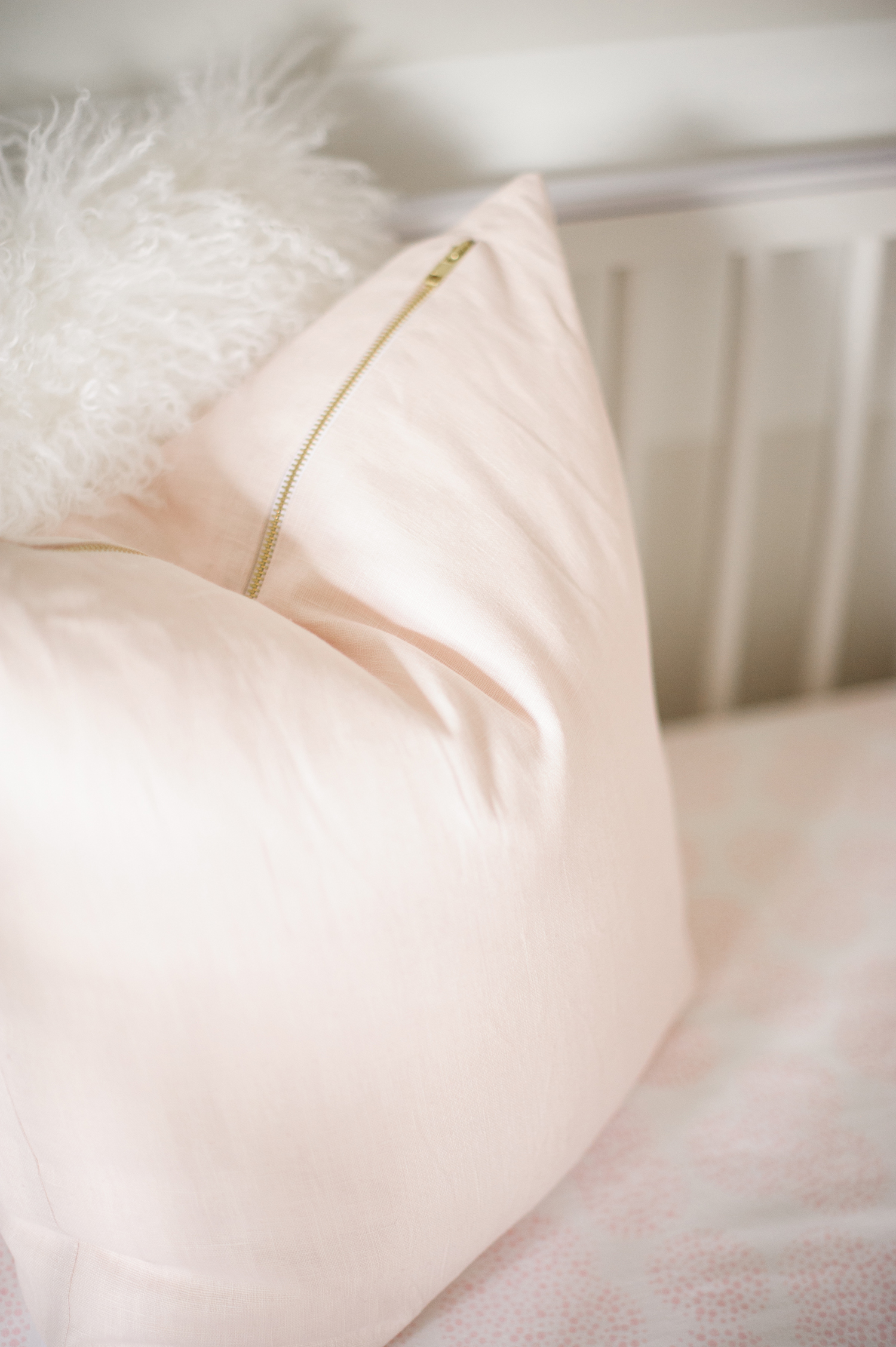Pink Pillow in Crib