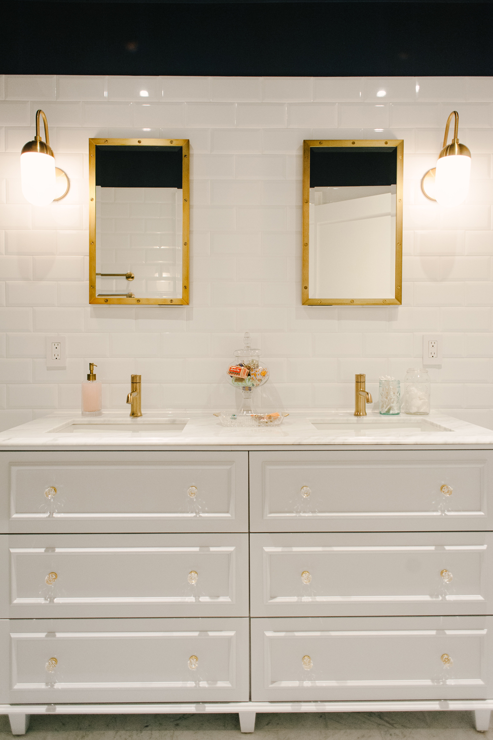 Luxurious double vanity with crystal and brass fixtures