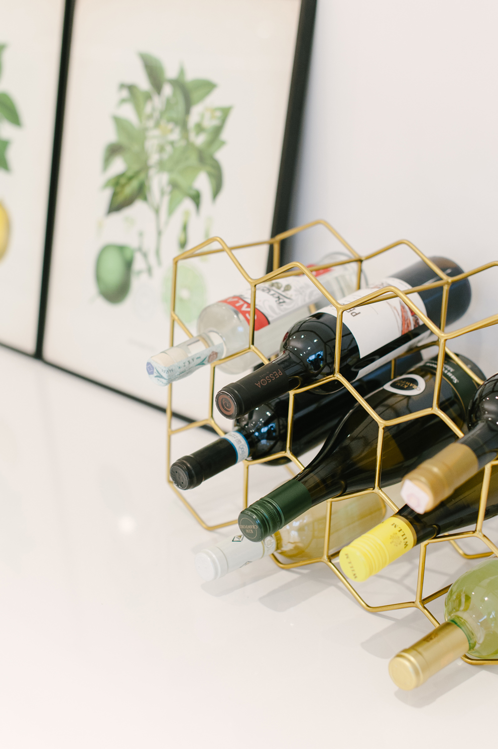 Gold hexagon wine rack on kitchen counter