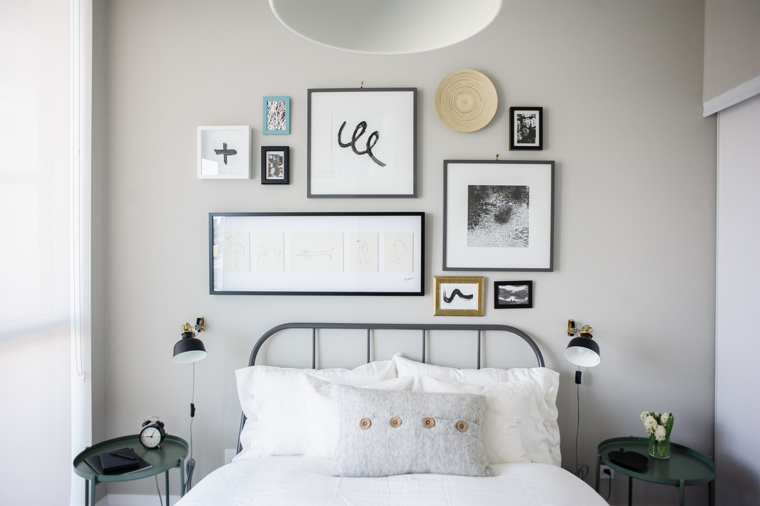 Grey guest bedroom with gallery wall