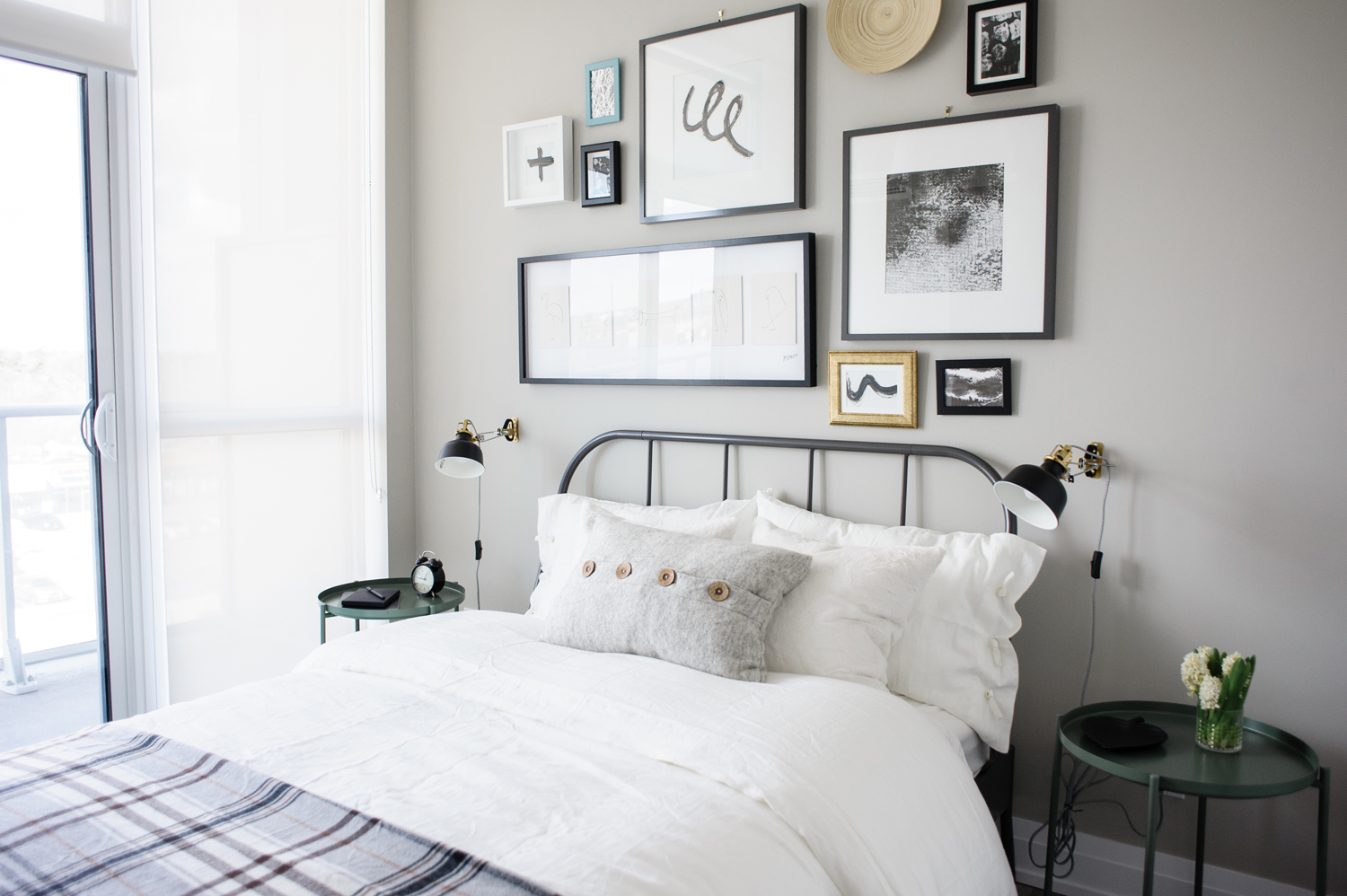 Guest bedroom with black and white gallery wall