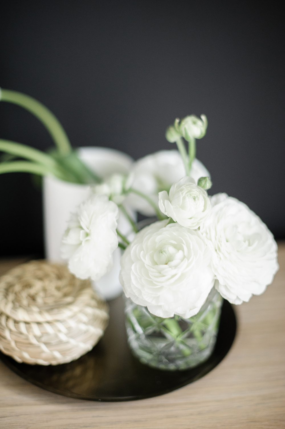 White flowers on a bedside table