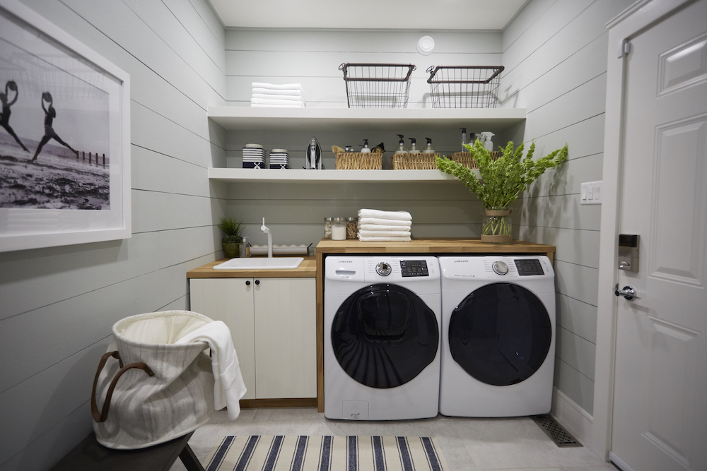 Nautical laundry room design with ample storage space.