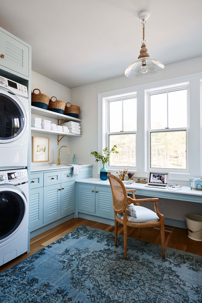 Bright blue laundry room and work station.