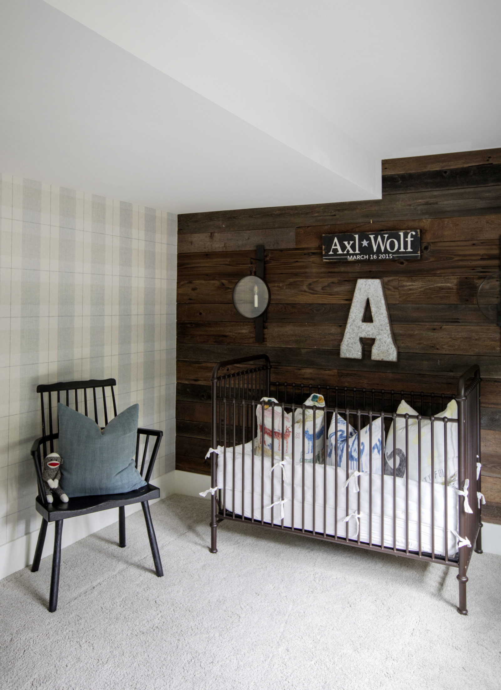 crib room with axl and wolf sign