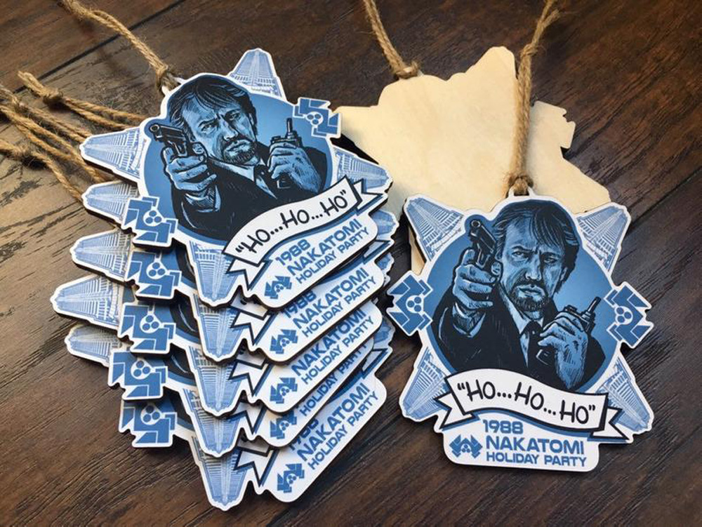 Hans Gruber (Alan Rickman) from Die Hard is featured on a blue and white Christmas ornament