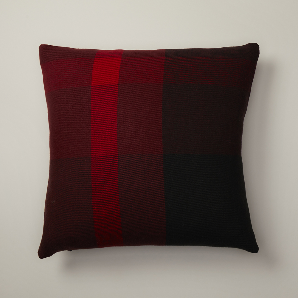 A red berry plaid pillow