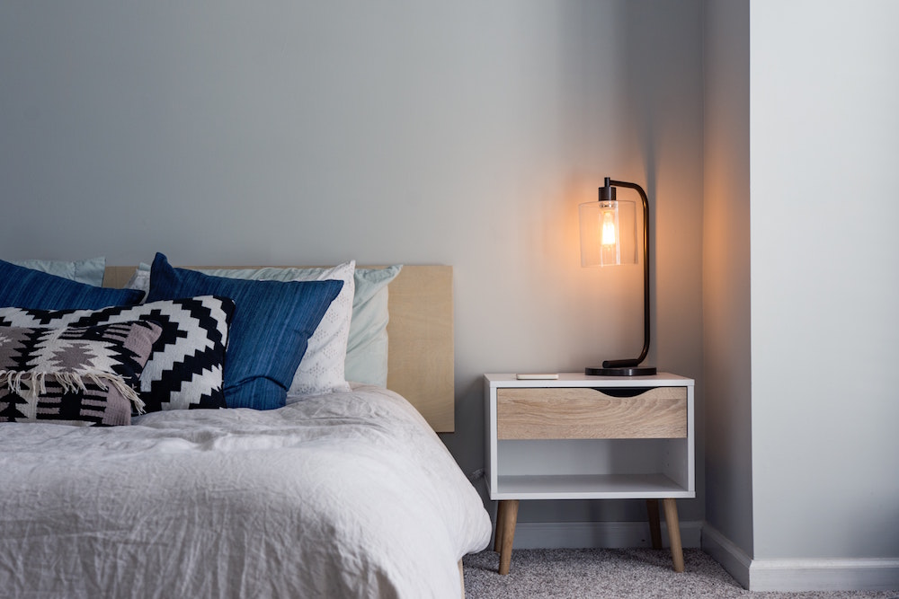 bedroom with lamp on nightstand