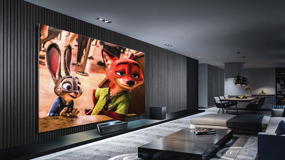 A high-tech movie room with an oversized TV screen, sleek furniture and an L-shaped couch