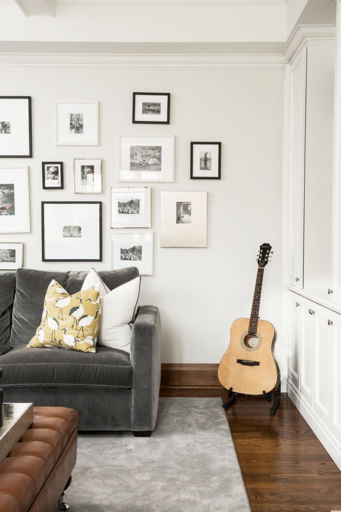 gallery wall, grey sofa, guitar