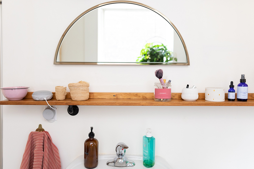 Bathroom vanity with semi-circle mirror