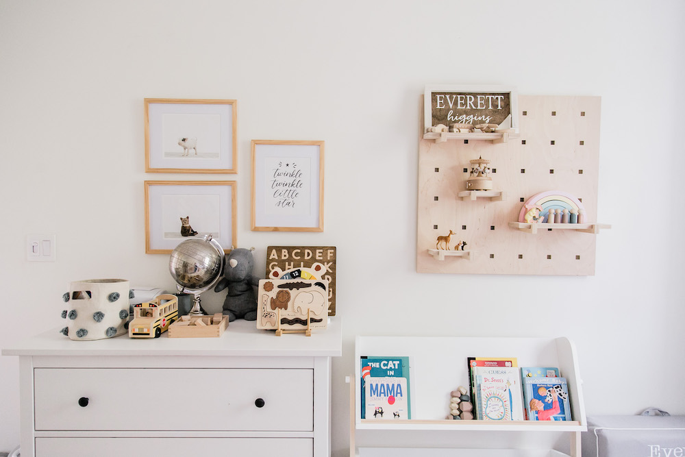 cozy nursery with wall art and pegboard