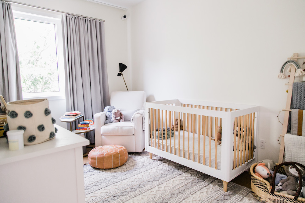 cozy nursery with white-and-wood crib