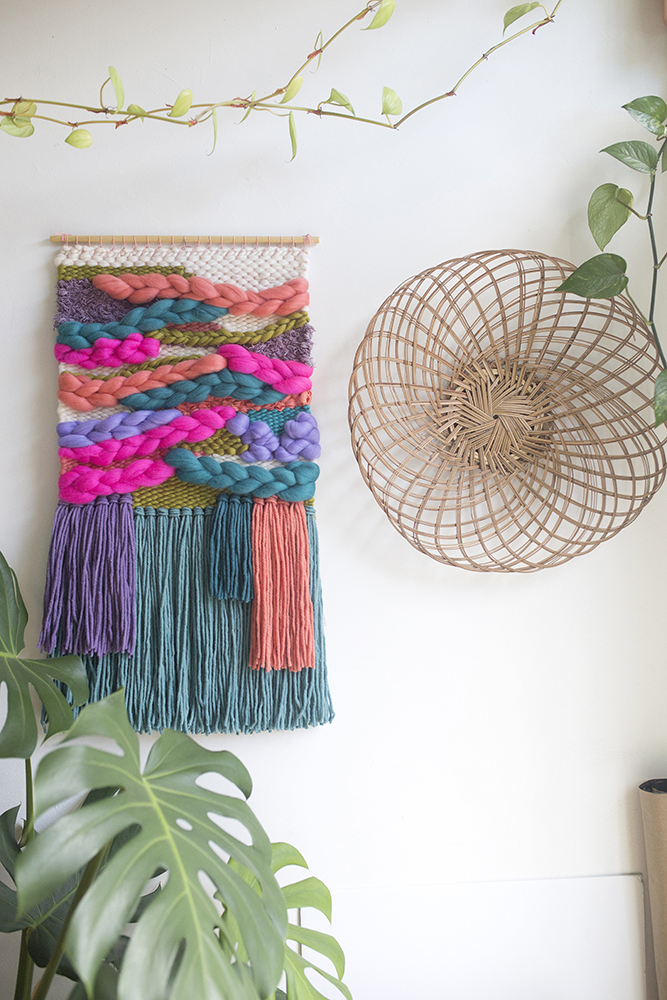 Macrame in bold colours hanging from the wall