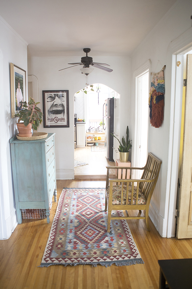 Boho chic home in hallway looking into kitchen