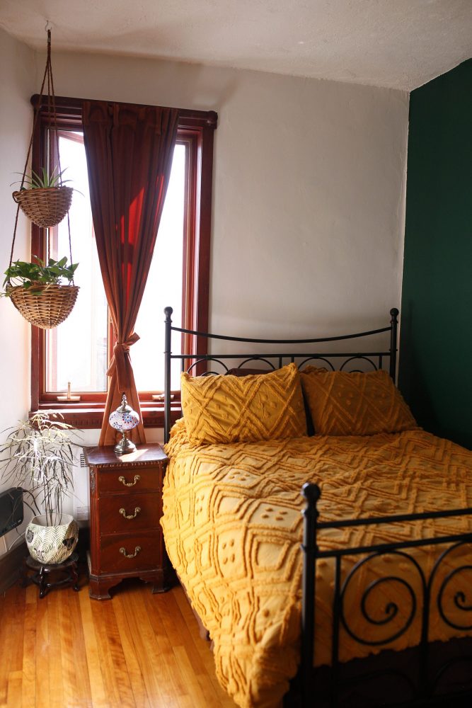 guest room with bright yellow bed