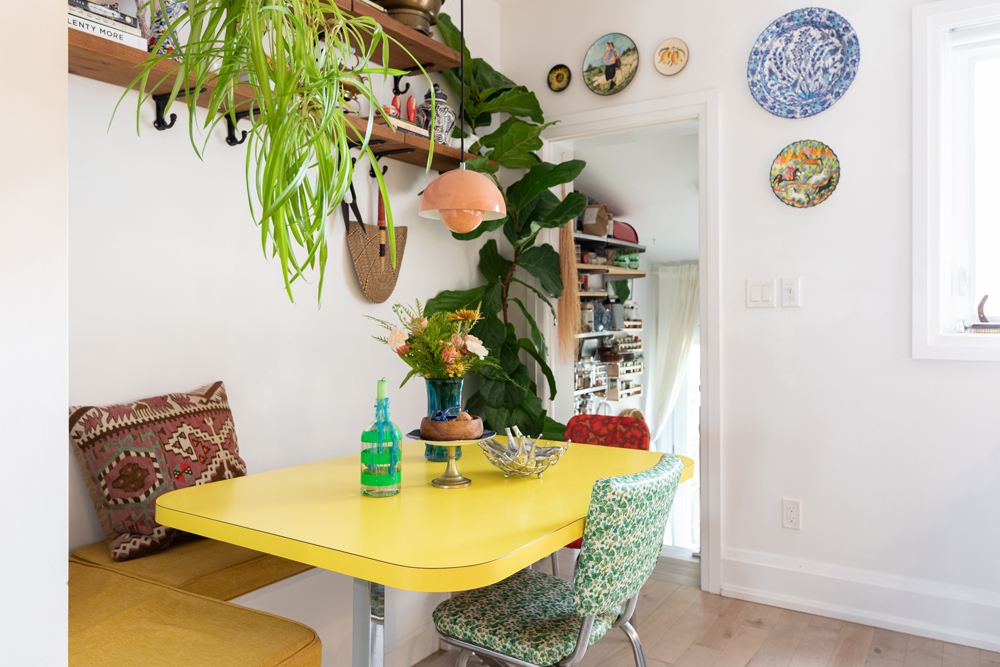 A bright and bold renovated kitchen with plenty of plants and layered textures