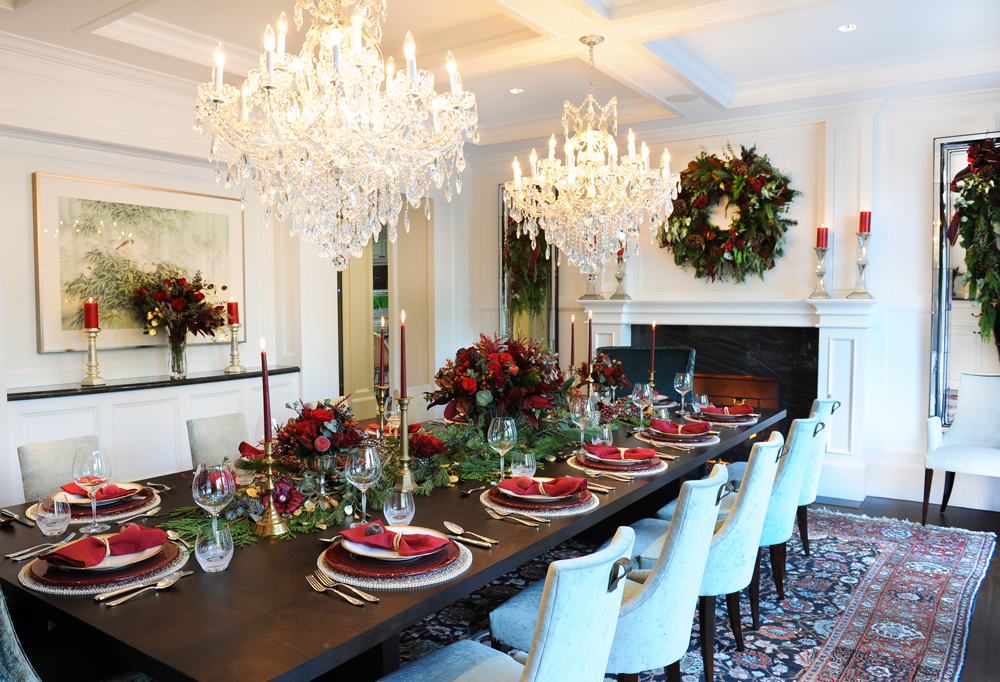 Dining room with festive wreaths, and table settings