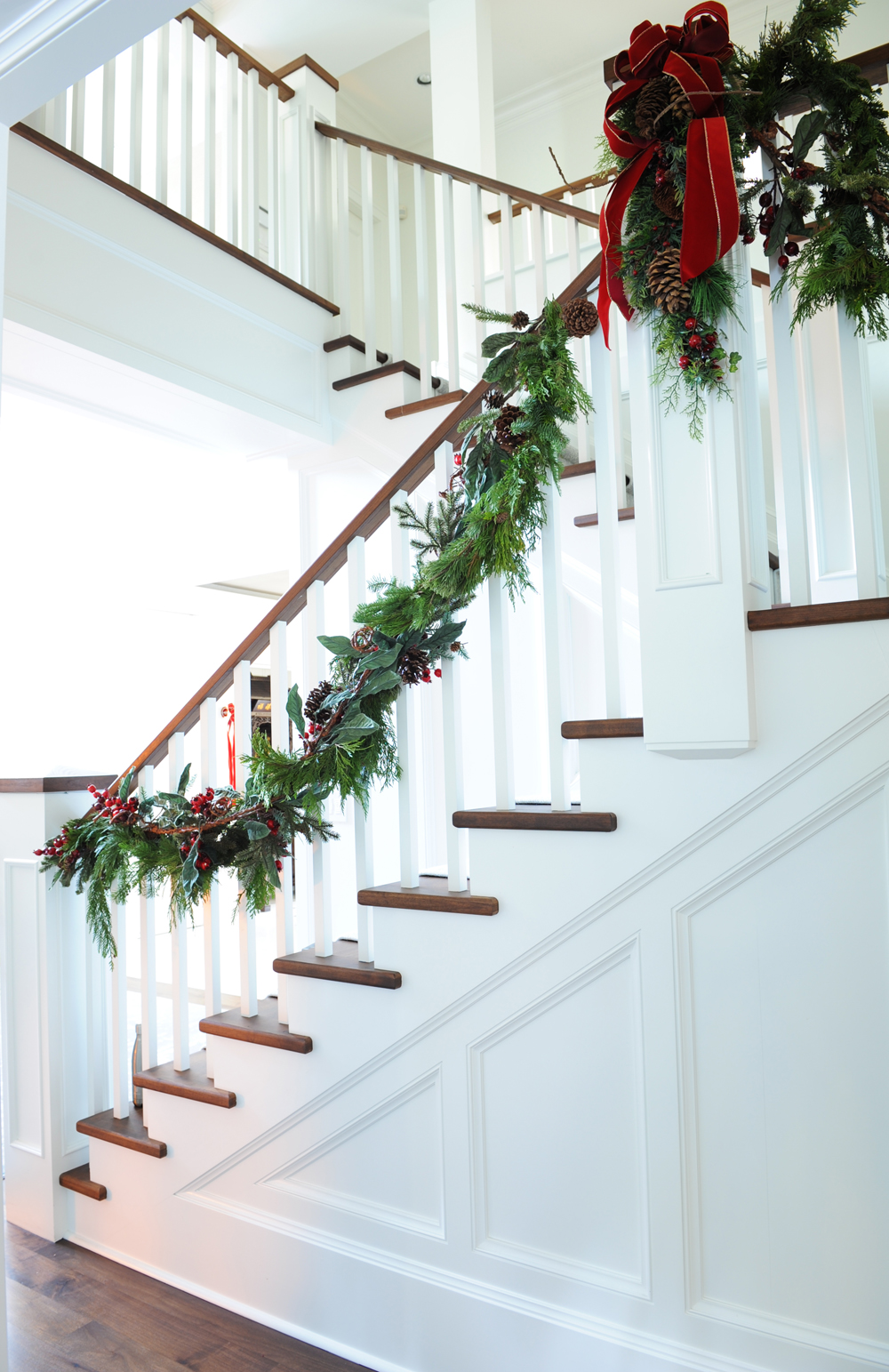 Traditional staircare with banister wrapped in garland