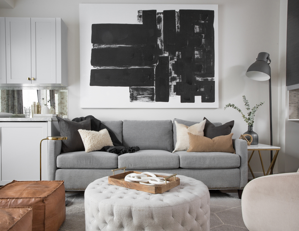 modern grey living room with black and white art