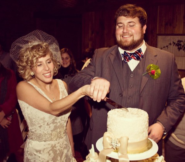 Ben and Erin Napier cutting cake at their wedding