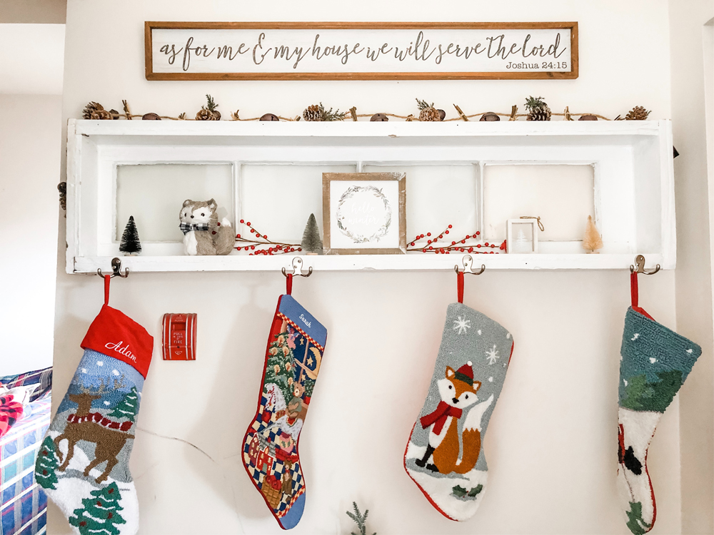 Decorative Christmas stockings hanging from shelf hooks