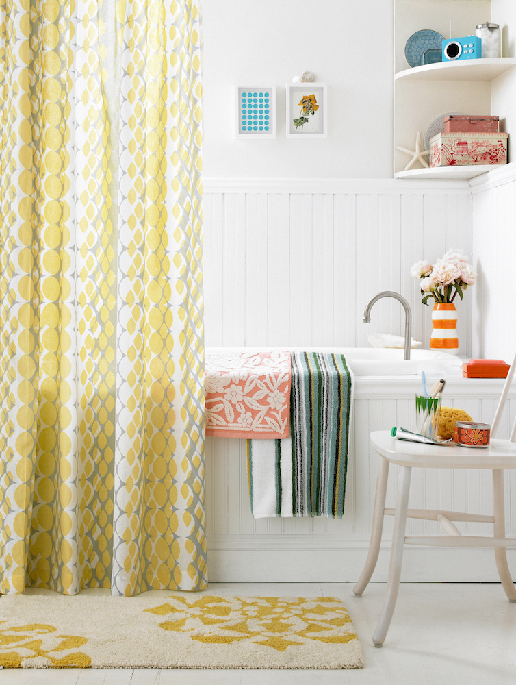 bright yellow shower curtain in colorful bathroom