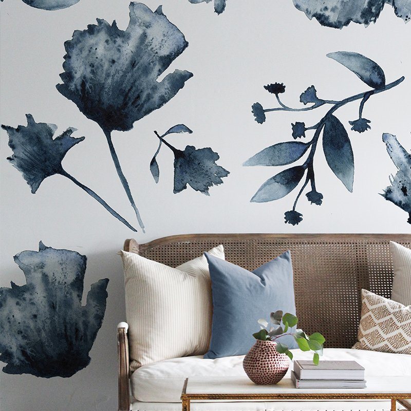 blue floral wall decals on white wall in living room with white couch
