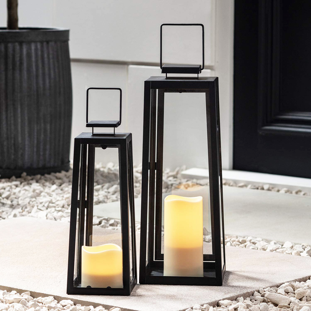 Two black matte battery-operated indoor lanterns with flickering white bulbs that imitate flames