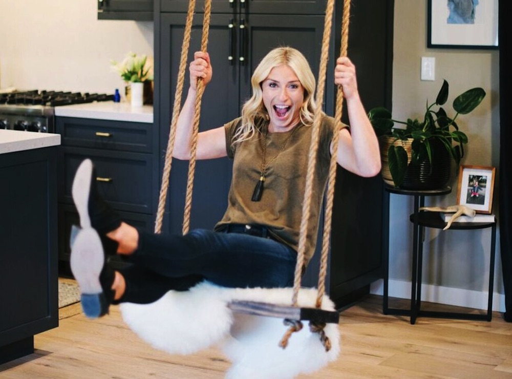 Jasmine Roth of Hidden Potential smiling on an indoor swing