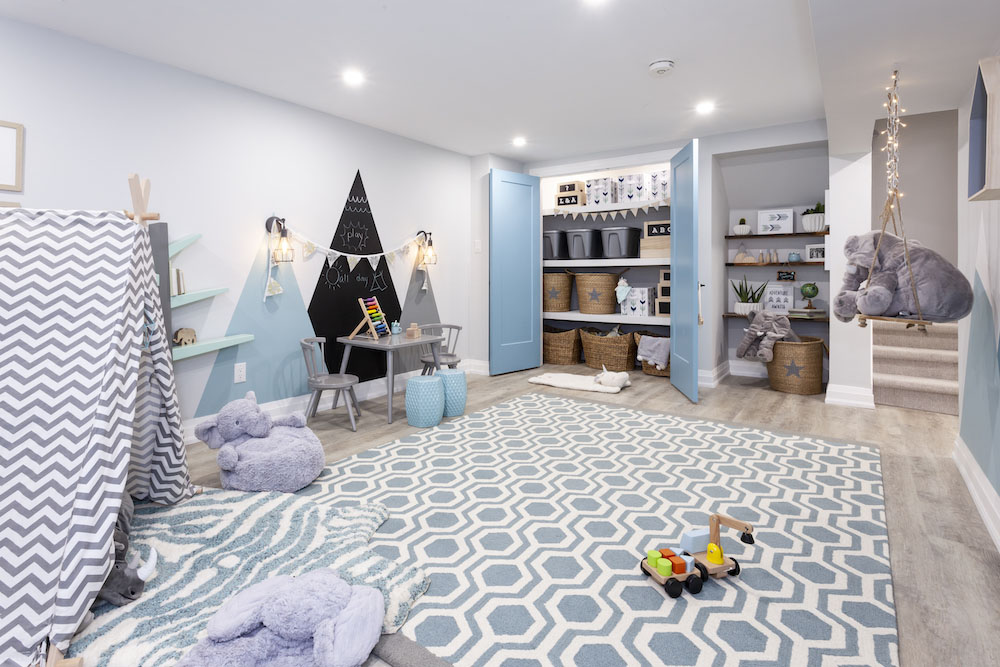 Basement play room with big graphic blue and white area rug