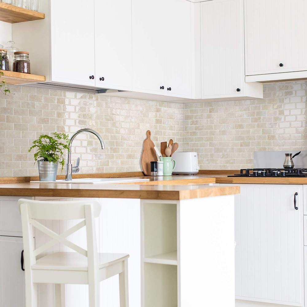 Peel and stick kitchen backsplash in white kitchen