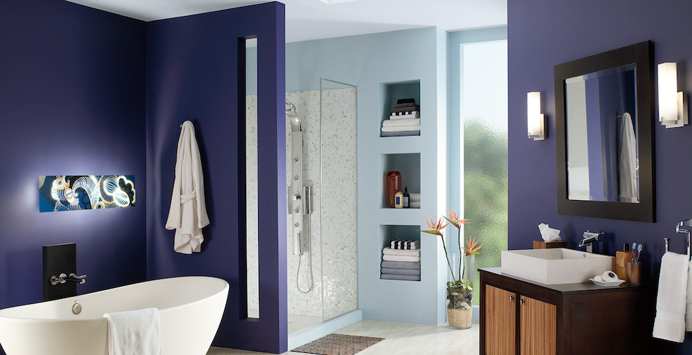 modern blue bathroom with white oval tub and light-blue shower room