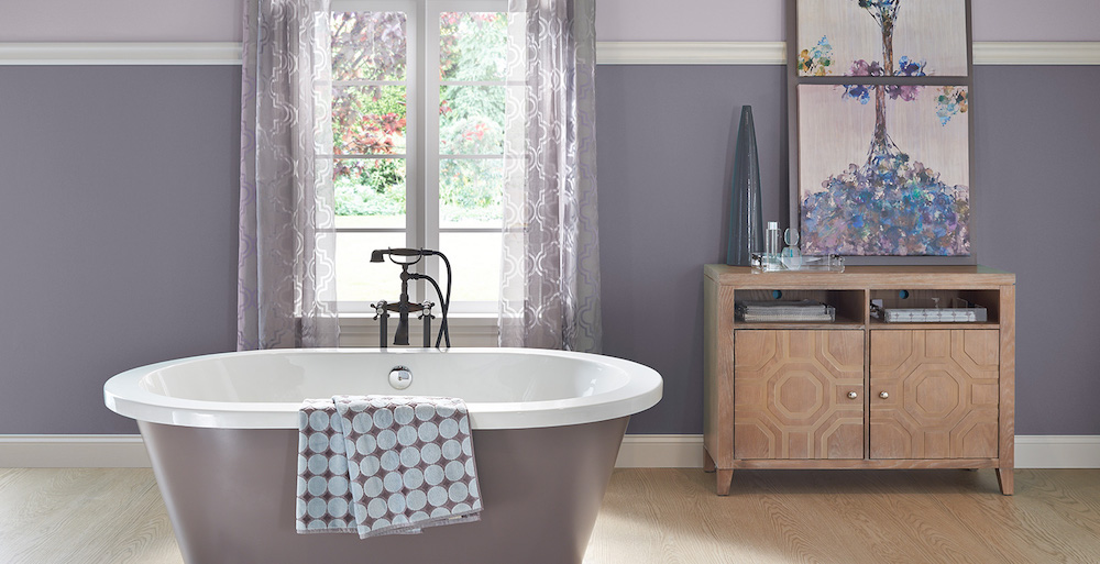 modern purple bathroom with oval tub and curtained window