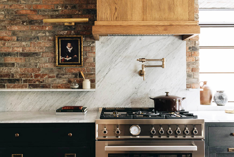 Brick-walled kitchen with little painting