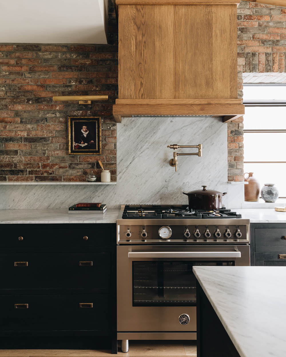 Brick-walled kitchen with little painting