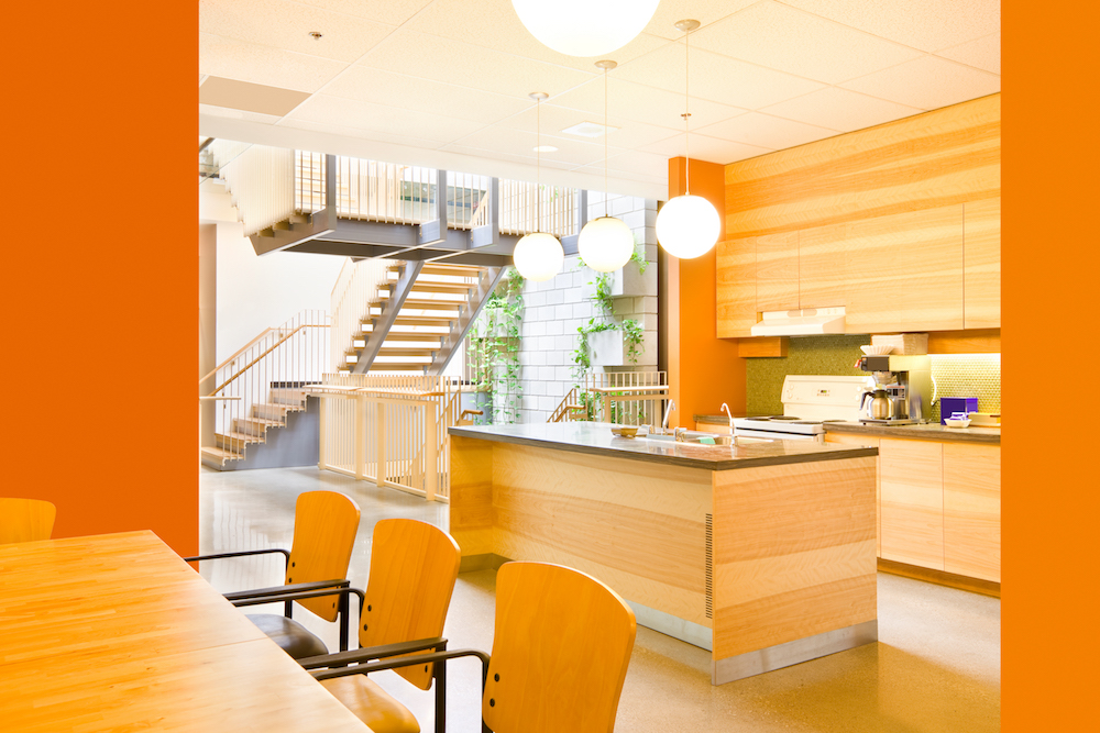 modern wooden and orange kitchen