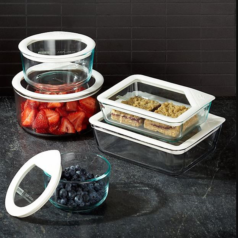 Glass storage containers with a variety of fruit and desserts