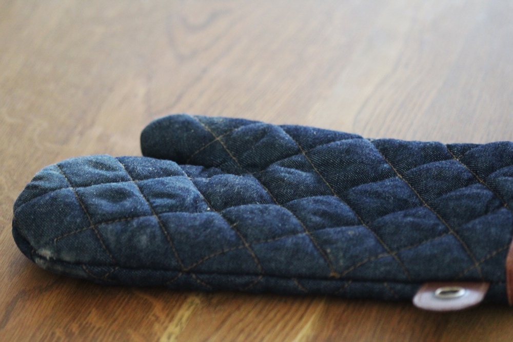 Old, dirty blue oven mitt