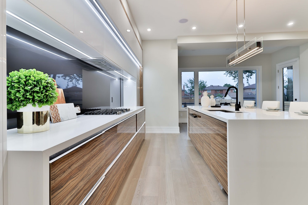 modern white kitchen with hanging bar light
