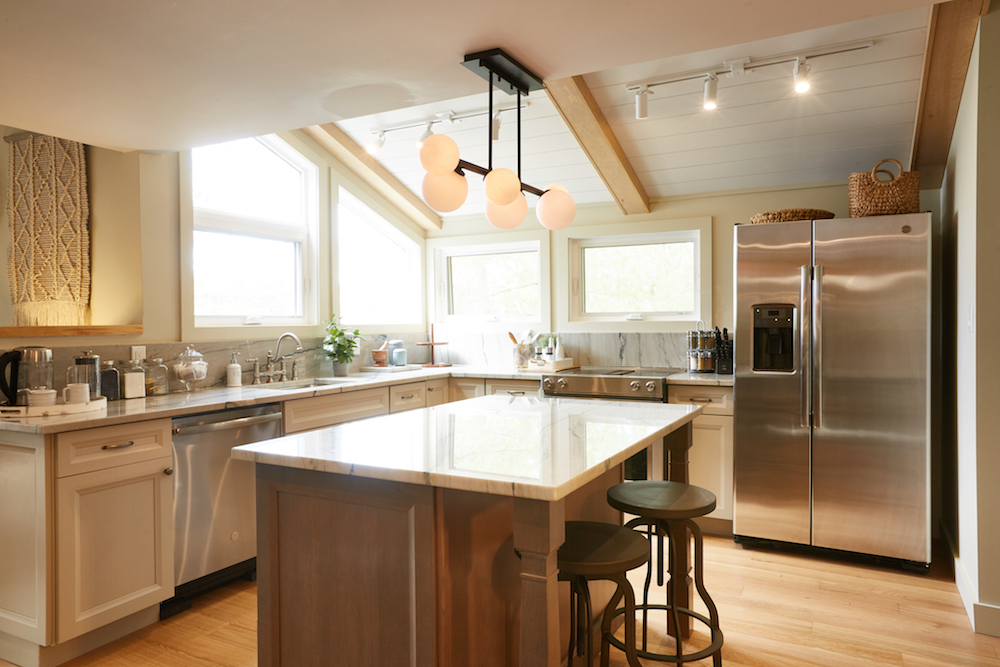 modern cream kitchen with new energy efficient windows and large island