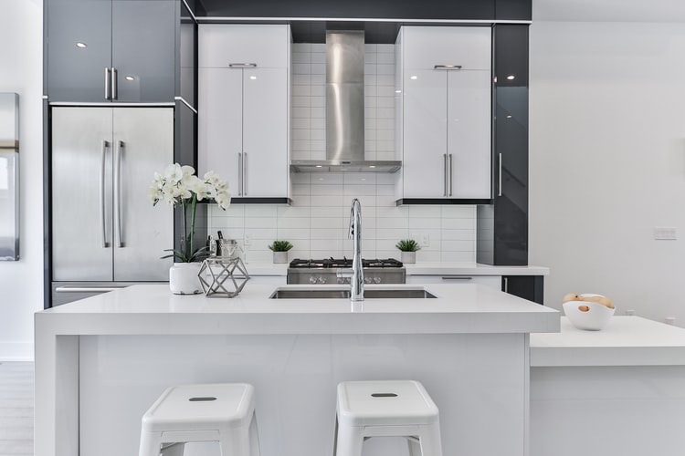 modern white kitchen with multi-height island