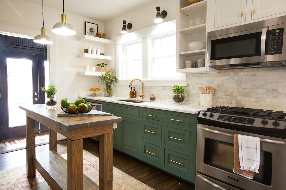 bright kitchen with mix of open shelves and cabinets, with green lower cabinets