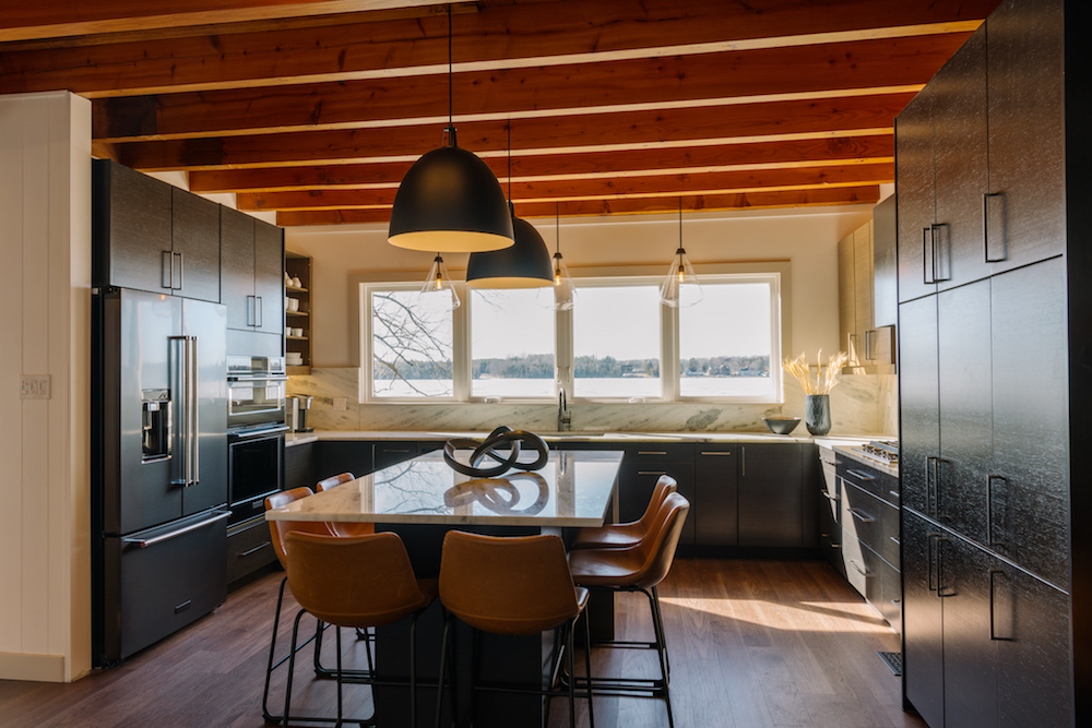 modern kitchen with a mix of pendant lights over the island and sink