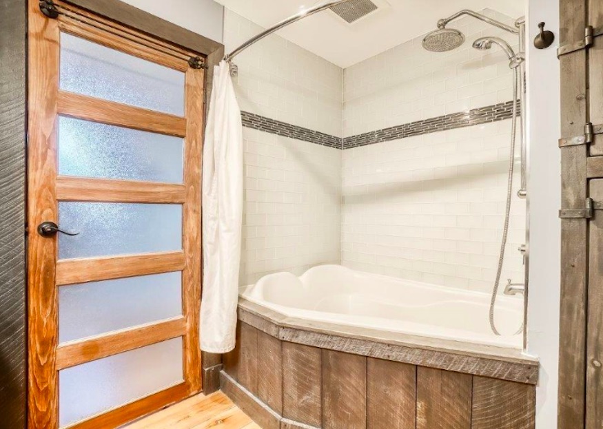 Wood-filled bathroom with a deep soaker tub